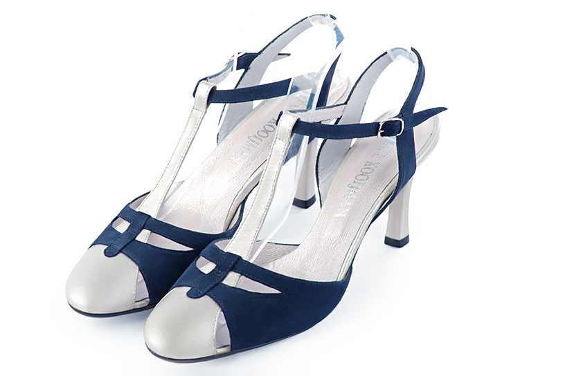 Light silver and navy blue women's open back T-strap shoes. Round toe. High slim heel. Front view - Florence KOOIJMAN